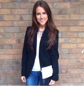 A picture of a girl wearing Zara black blazer, Zara white vest and Topshop skinny jeans