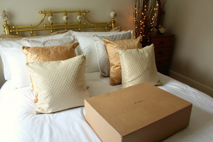 A picture of a white and gold bed with a Zara delivery 