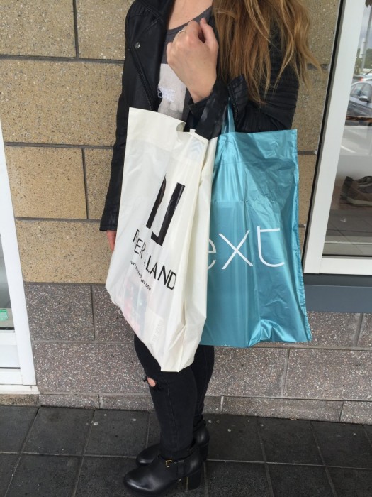 A picture of a girl with shopping bags
