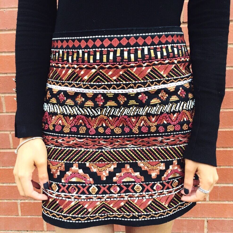 A picture of a fashion blogger wearing H&M embroidered skirt