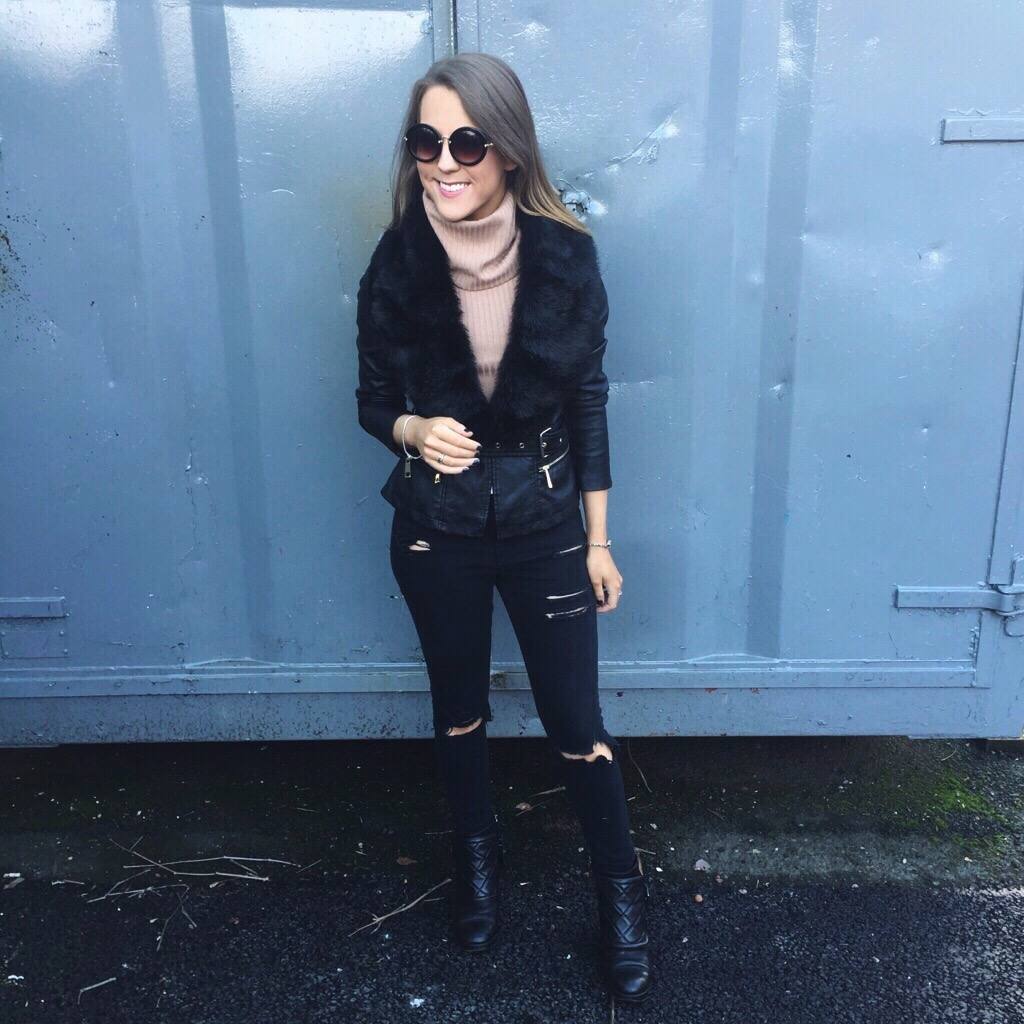 A fashion blogger wearing a River Island black leather jacket