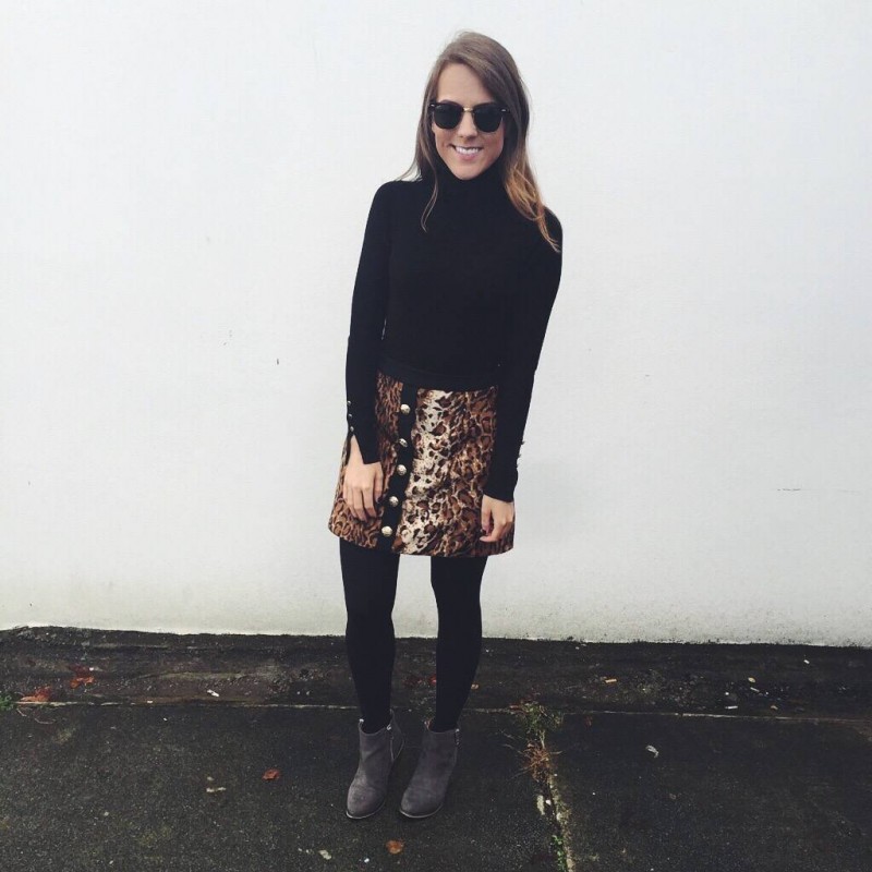 A fashion blogger wearing a River Island leopard print skirt