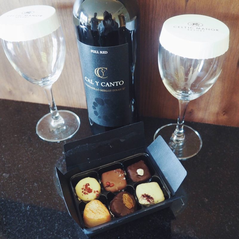 A picture of red wine and chocolates